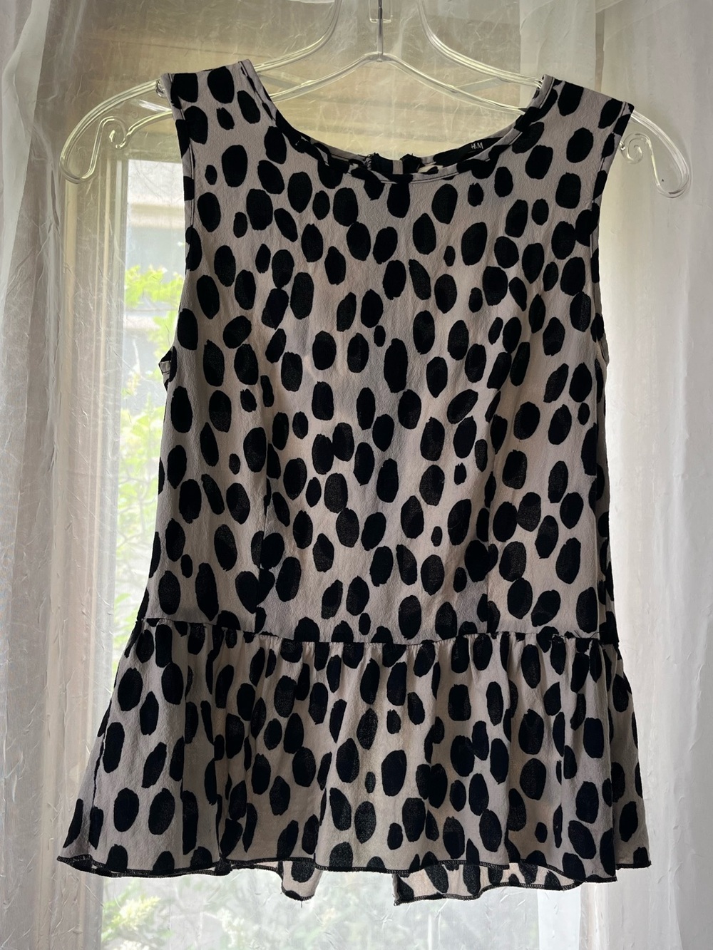 Sleeveless black and white dot print Peplum Top - Women